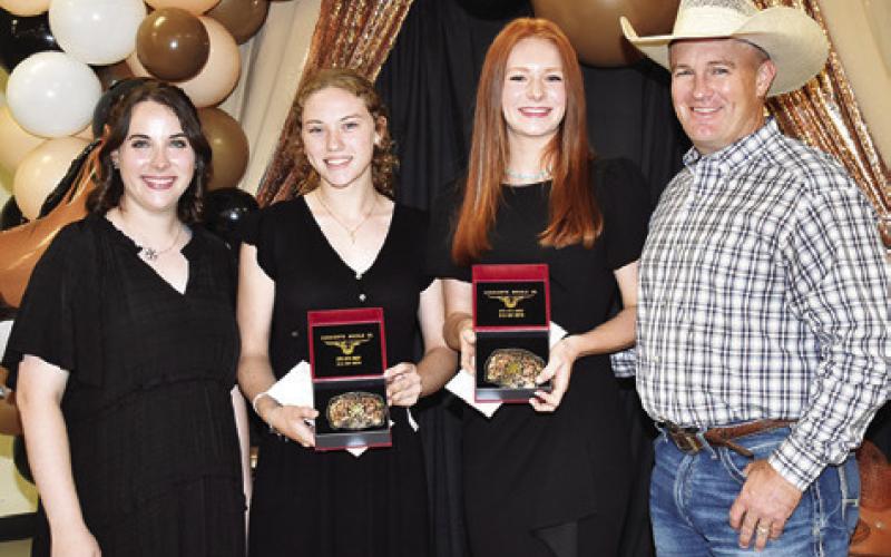 AVA FRY AND Cayle Canon are presented the I Dare You Awards by Megan Rogers and Steve Canon. Tribune photo by Roy Sanders