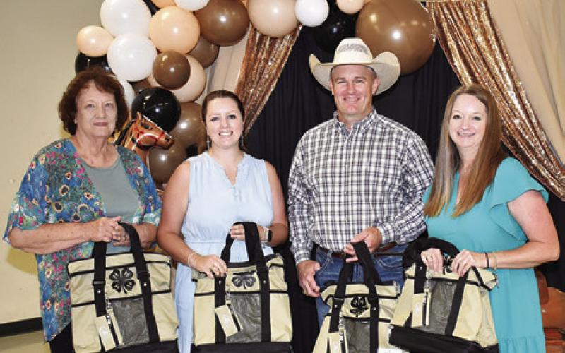 BURLESON COUNTY 4-H ADULT Leaders Association Officers recognized included, from left, Beverly Blinka, Hannah Kovar, Steve Canon and Christy Faust. Tribune photo by Roy Sanders