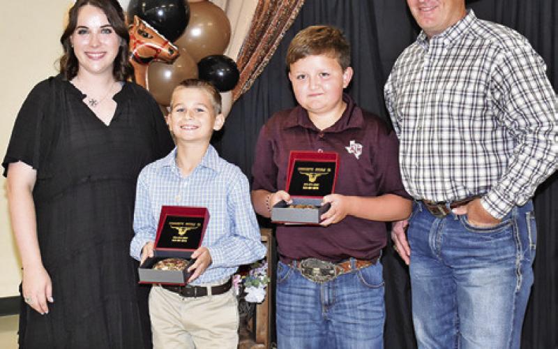 GRAYSON GIESENSCHLAG and Jase Hruska are presented the Bronze Star. They are joined by Megan Rogers and Steve Canon.