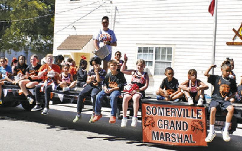 THE SOMERVILLE YOUTH SPORTS Association members are honored as grand marshals at the Saturday homecoming parade in downtown Somerville.