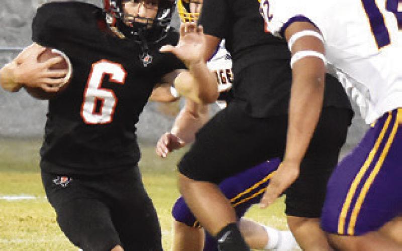 COLT HOLTON OF Somerville carries the ball against Granger. Tribune photo by Roy Sanders