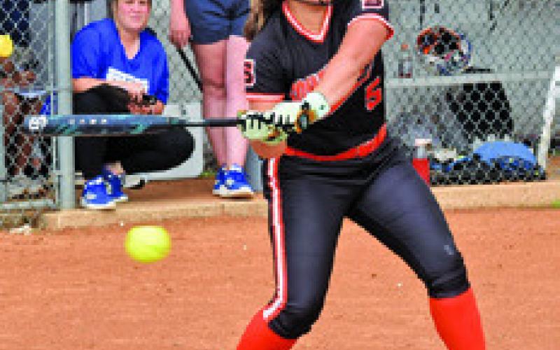 AVERIE HERNANDEZ watches the ball go by while at bat during the during the Somerville-Snook game last Friday in Snook. Tribune photo by Roy Sanders