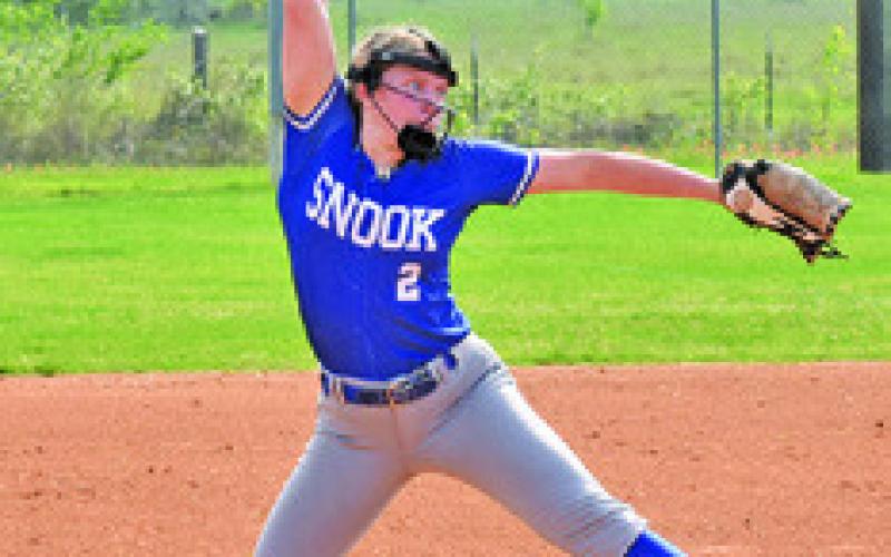 SNOOK ACE AUBREY Becker sets to release the pitch during the Somerville-Snook game last Friday in Snook. Tribune photo by Roy Sanders