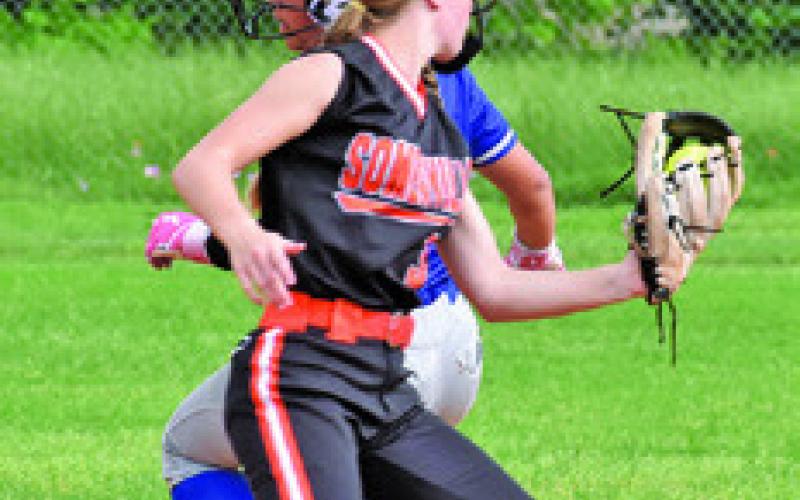SOMERVILLE’SAUBREYFlencher looks at Snook runner Marissa Batiste during the Somerville-Snook game last Friday in Snook. Tribune photo by Roy Sanders