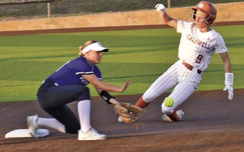 CALDWELL’S MOLLY MEADOWS slides into second base during the Caldwell-Navasota game on Friday night at Weiss Field. Tribune photo by Roy Sanders