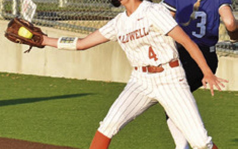 BRYNN MORTON catches the throw at first during the Caldwell-Navasota game on Friday. Tribune photo by Roy Sanders