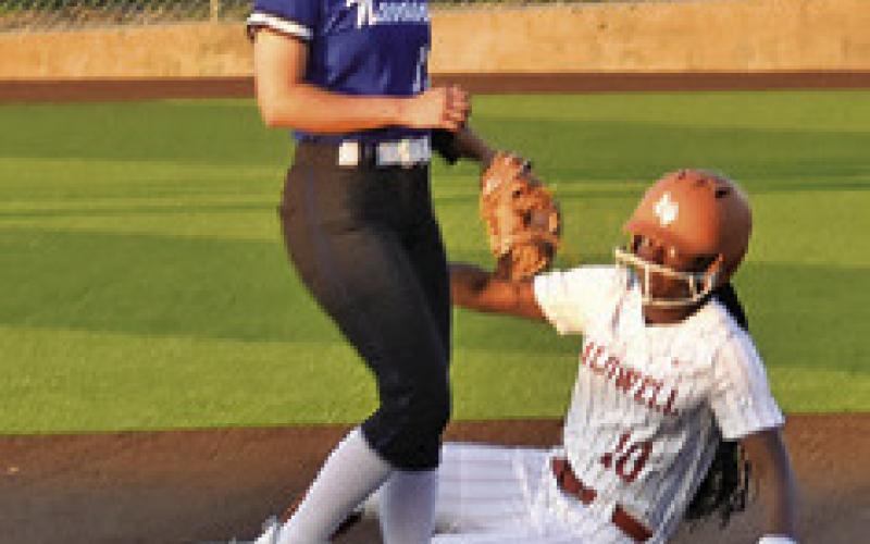 MESHA JOHNSON slides safely into second during the Caldwell-Navasota game on Friday. Tribune photo by Roy Sanders