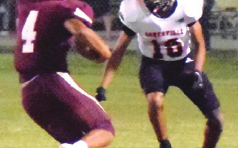 ISAAC SANCHEZ prepares to tackle a Milano player during the Somerville-Milano game last Friday night. -- Tribune photo by Bailey Brown