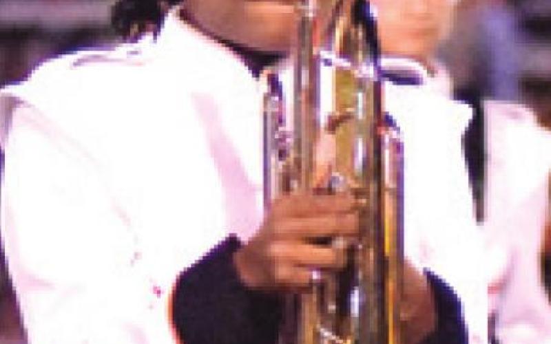 CAMIA MARTIN LOOKS at the Somervile Yegua Band drum major during last Friday night’s halftime show in Milano.