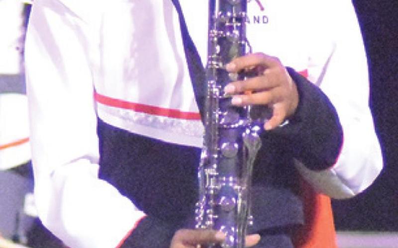 RA’MAYA CARTER plays her bass clarinet during the halftime show of last Friday’s Somerville-Milano football game.