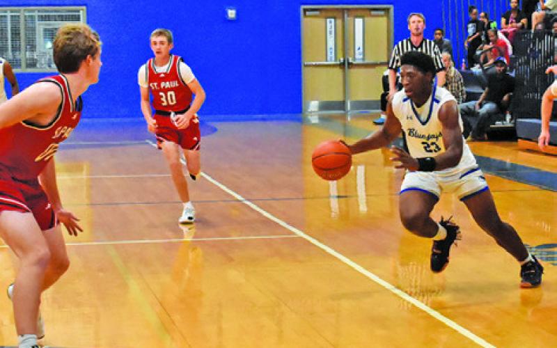 KE’TREEN CARTER OF Snook dribbles the ball against St. Paul in the Bluejays’ 54-38 win last Friday in Snook. Tribune photo by Roy Sanders