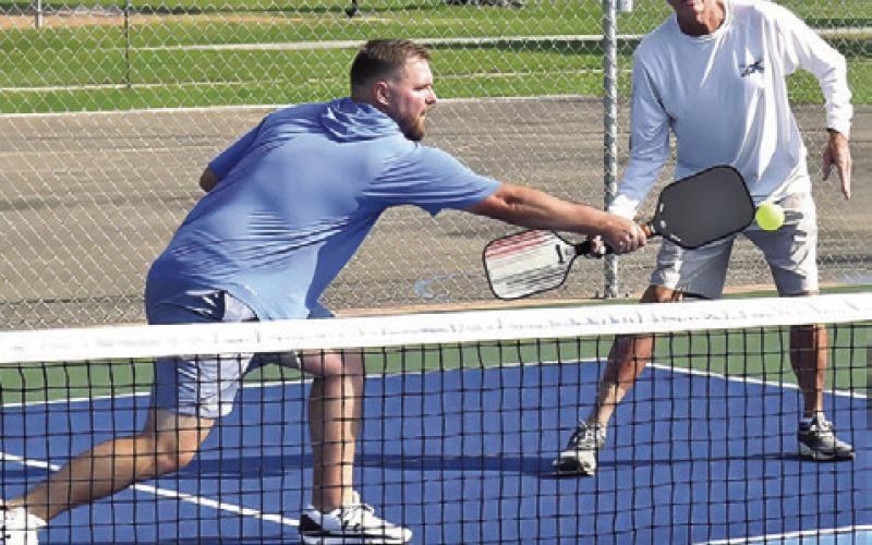 PICKLEBALL PLAYERS INCLUDING Dusty Lowe, right, enjoy Caldwell’s first pickelball tournament on Saturday at John E. Hejl Park. -- Tribune photo by Roy Sanders