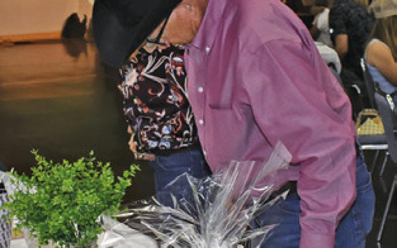AUCTION ITEMS are observed by area residents at the Haley’s Halo Barn Dance on Sunday, April 19, at the Caldwell Civic Center.