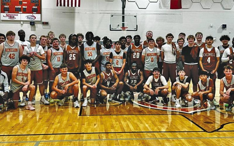 CALDWELL’S PLAYERS GATHER FOR the scrimmage with the alumni on Nov. 11 in Caldwell.