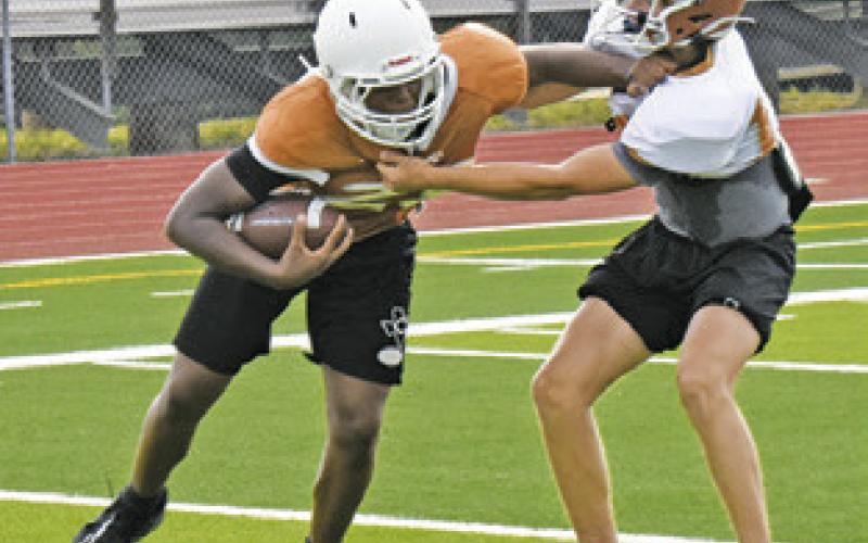 THE PASSING game and defensive secondary coverage was worked on at the Monday practice. -- Tribune photo by Roy Sanders