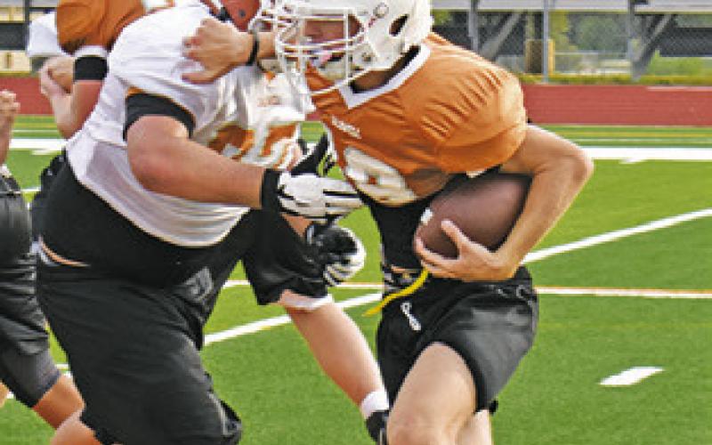 THE CALDWELL Hornets work on their plays on Monday. They open this Friday at home against Groesbeck at 8 p.m.