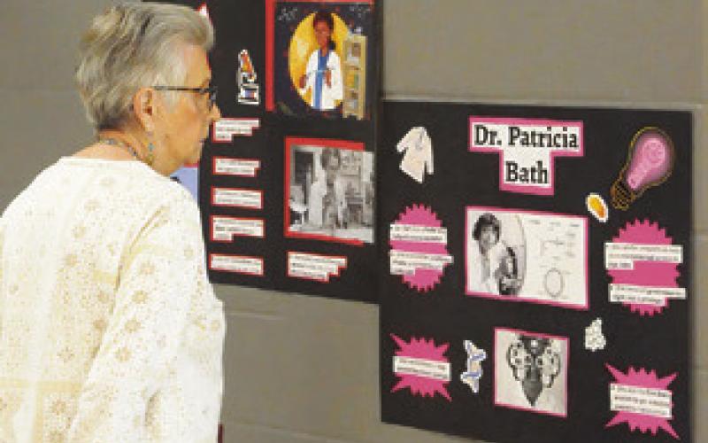 STAFF, STUDENTS AND RESIDENTS viewed projects by students at Somerville Elementary/ Intermediate School, honoring Black History Month in the school’s “Visions of Victory” display in the cafeteria. Tribune photo by Denise Squier