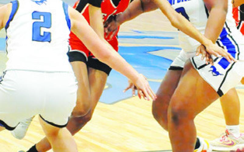 KARYS ELLIS dribbles through two Lady Mustangs during the Somerville-Mumford game last Friday night in Mumford. Tribune photo by Denise Squier