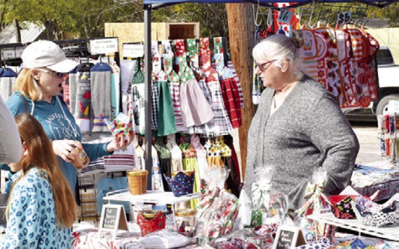 VENDORS AND VISITORS enjoyed the Farmers Market last Sunday, Dec. 1, in Somerville. Christmas was the theme for this month.