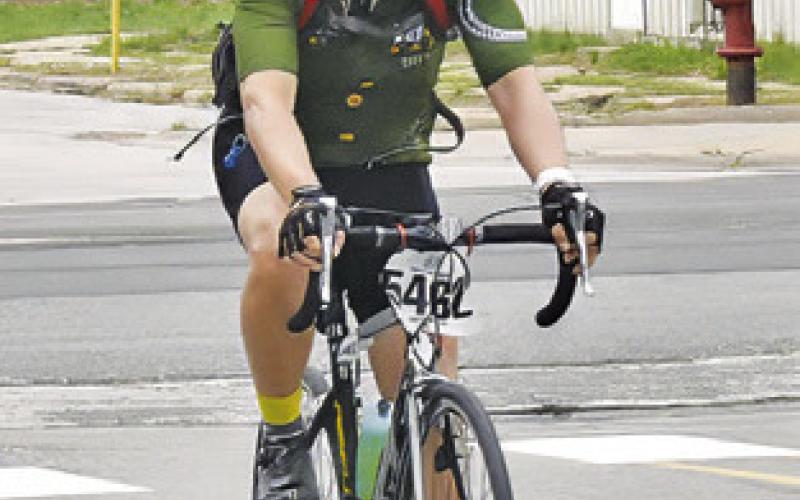 BIKERS FROM the MS 150 bike ride arrive in Somerville on Sunday, April 28. The event raised money for the Multiple Sclerosis Society, and local residents gathered to cheer them. -- Tribune photo by Roy Sanders