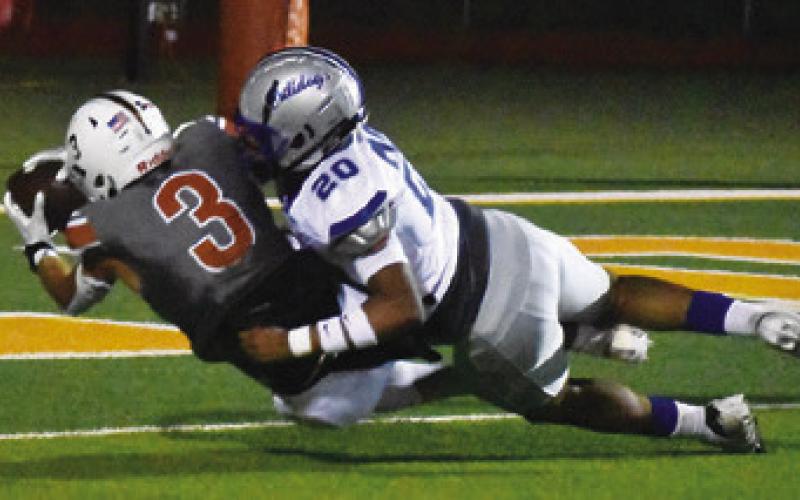 COY BECKA OF Caldwell lunges for the endzone during Friday’s win against Crockett. Tribune photo by Roy Sanders
