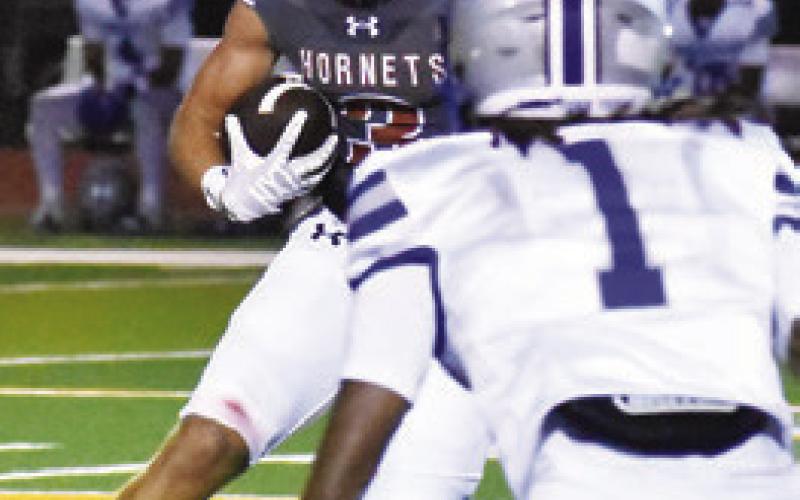 CALDWELL’S COY Becka carries the ball as this Crockett defender approaches. Tribune photo by Roy Sanders