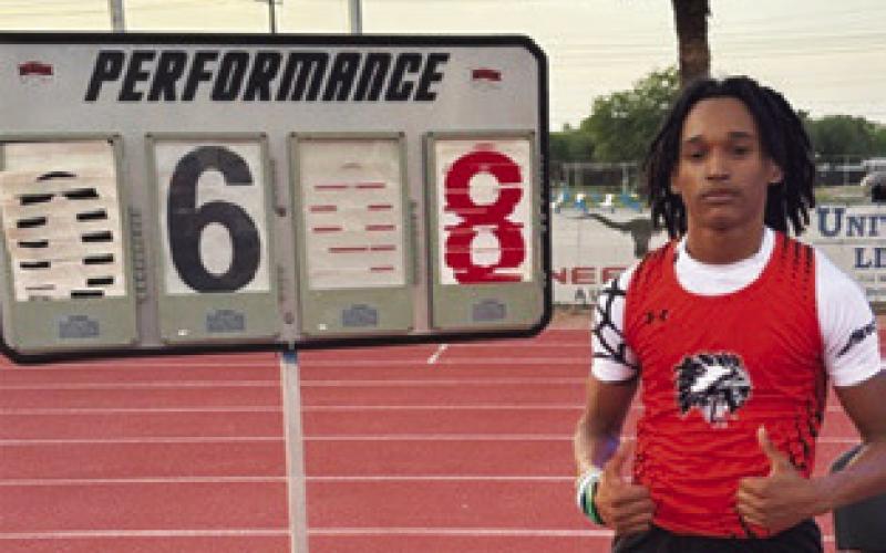 SOMERVILLE’S JEREMY Vela stands next to his first place high jump height of 6 feet 8 inches at last week’s UIL Class 2A Region 4 Track &amp;amp; Field Meet in Kingsville.