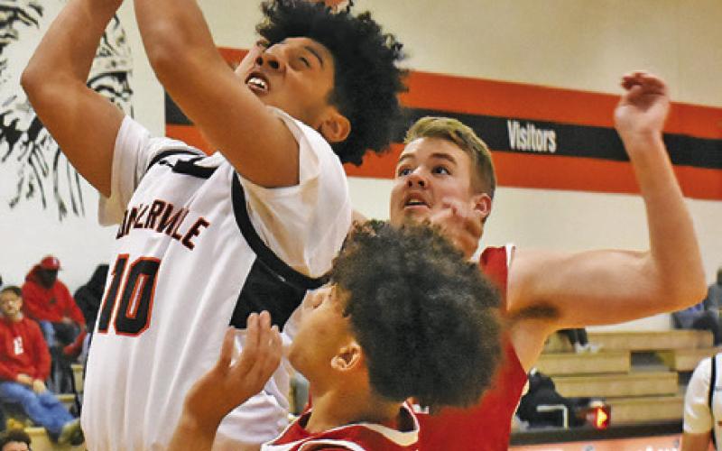 JORDAN SMITH OF Somerville takes a shot against Burton. Tribune photo by Roy Sanders