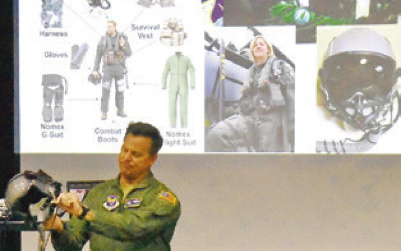 COLONEL LANCE BURNET, USAF (ret.), showed area children some of his flight gear at the Caldwell Civic Center during last week’s “Ready for Take-Off!” event, hosted by the Harrie P. Woodson Library.