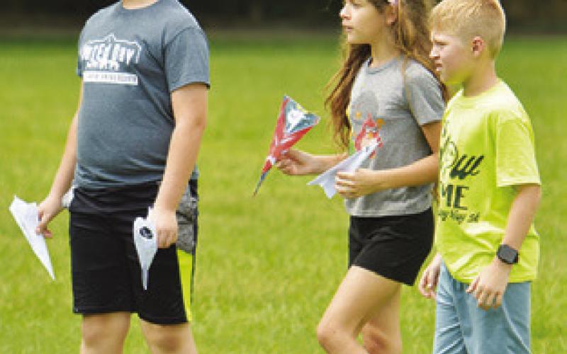 AREA CHILDREN made paper airplanes during last week’s “Ready for Take-Off!” event, hosted by the Harrie P. Woodson Library.