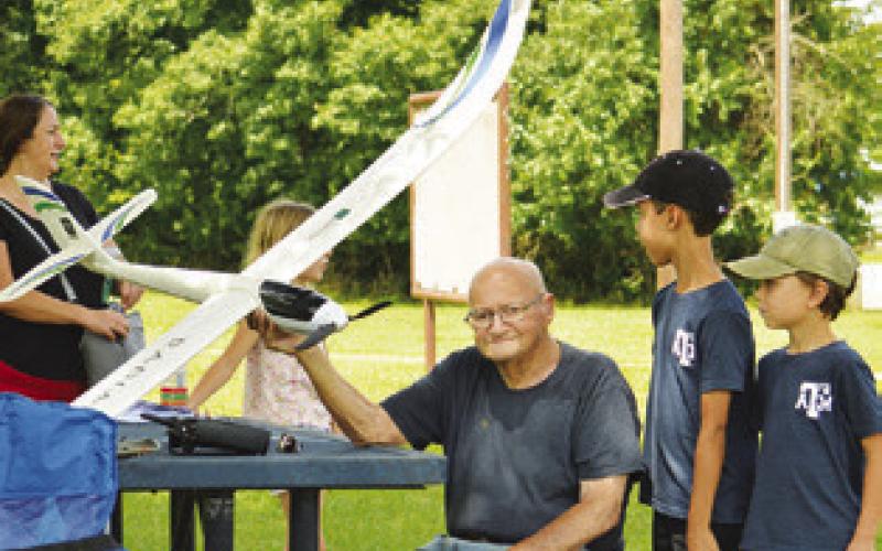 ELBERT OBERTS IS PICTURED with his remote control airplane at the soccer fields at Davidson Creek Park at last week’s “Ready for Take-Off!” event, hosted by the Harrie P. Woodson Library.