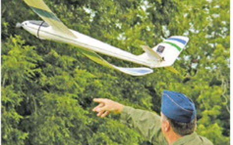 COLONEL LANCE BURNET, USAF (ret.), helped launch Elbert Oberts’ remote control plane during last week’s “Ready for Take-Off!” event at Davidson Creek Park.