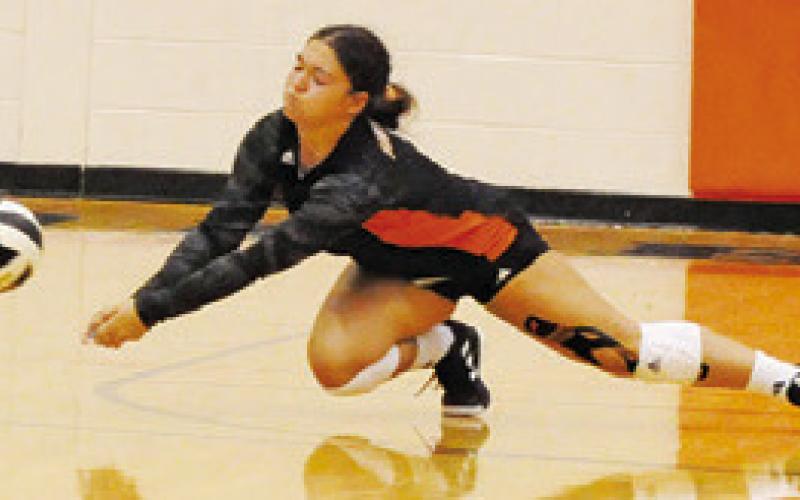 AVERIE HERNANDEZ dives to save the ball during the Somerville-Hempstead match. Tribune photo by Denise Squier