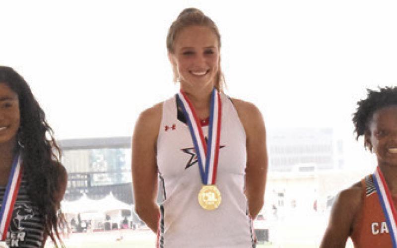 JAE MATHIS, RIGHT, is pictured with the other medalists, Falyn Lott, left, and Emily Thames, center, from the Class 4A girls’ long jump at the UIL State Track &amp;amp; Field Meet in Austin. -- Tribune photo by Roy Sanders