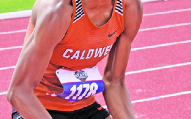 JAE MATHIS CELEBRATES her bronze-winning jump at the UIL State Track &amp;amp; Field Meet.