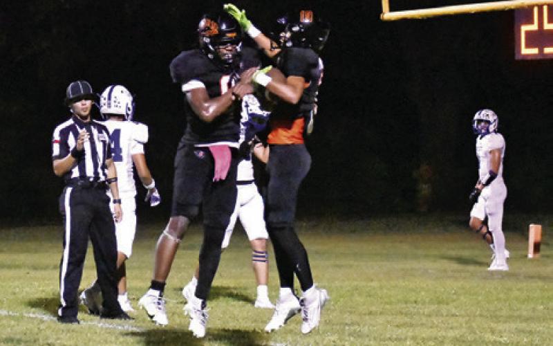 JA’KEITH DANIELS and Jaille Deere celebrate a touchdown last Friday against Bartlett. Somerville won 54-34. Tribune photo by Roy Sanders