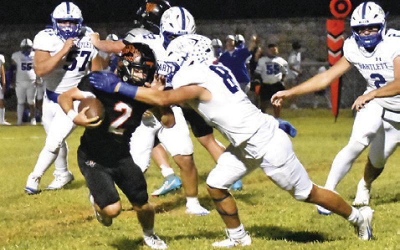 COLT HOLTON OF Somerville carries the ball against Bartlett. Tribune photo by Roy Sanders