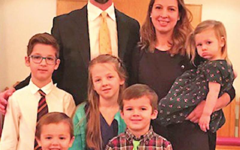 PASTOR ANDREW KEUER and his family