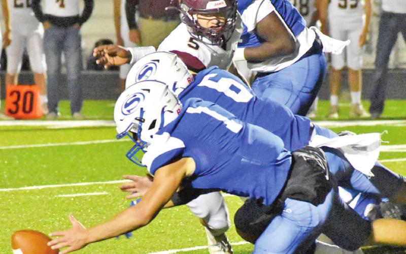 SNOOK’S GARRETT LERO and Jose Garcia go for this loose ball against Milano last Friday. -- Tribune photo by Roy Sanders