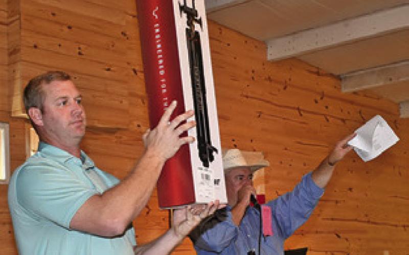 ITEMS ARE AUCTIONED on Saturday in Dime Box at the Lynnlee Kocurek fundraiser.