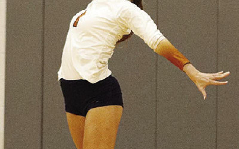 LUCY FERGUSON serves during a match at the Huntsville Volleyball Tournament. Photo courtesy of Casey Faske