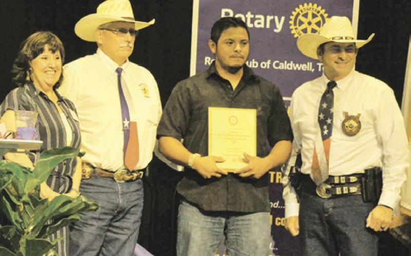 BURLESON COUNTY DEPUTY Steven Guerrero was named “Rookie of the Year” during the Law Enforcement Appreciation Banquet. Pictured with Guerrero are Rotary President Lia Zaccagnino, Sheriff Gene Hermes and Chief Deputy Bill Rios. Photo courtesy of Cathy Hutcheson