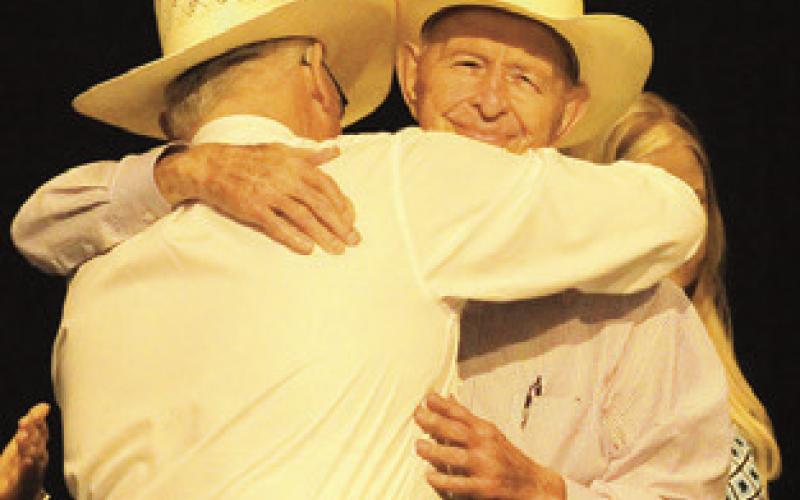 BURLESON COUNTY Sheriff Gene Hermes hugs former sheriff Dale Stroud after Hermes presented Stroud with the “Guardian of Burleson County Award” last Friday. Photo courtesy of Cathy Hutcheson