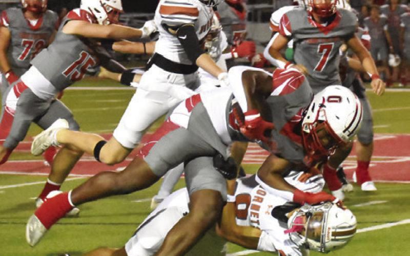 DYLAN CARTER OF Caldwell makes a tackle against Bellville. Tribune photo by Roy Sanders