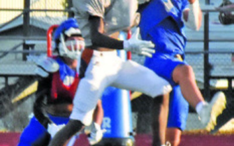 CALDWELL’S JIMMY KEARNEY strips the ball in the scrimmage with Anderson-Shiro.