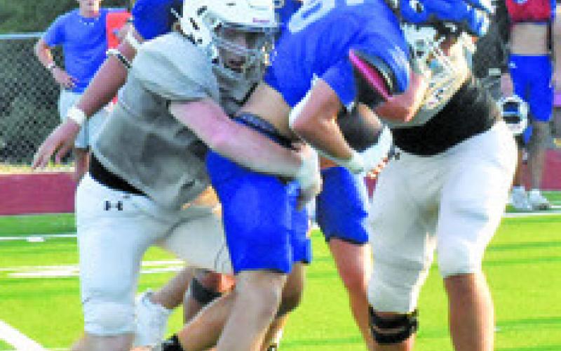 ANTHONY HALL AND Koy Macik make a tackle against Anderson-Shiro.