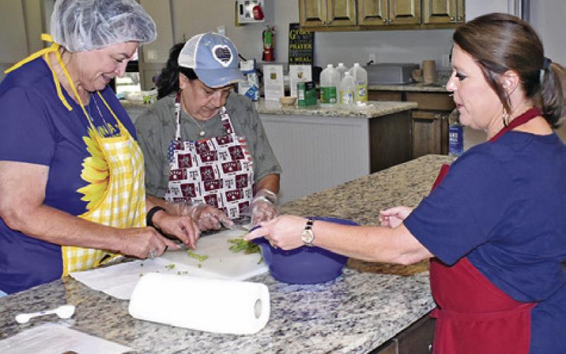 HOLLY NARRO OF Texas AgriLife Extension offers tips at a Hands-On Canning Workshop last Friday, May 31, at HUS School Encampment. -- Tribune photo by Roy Sanders
