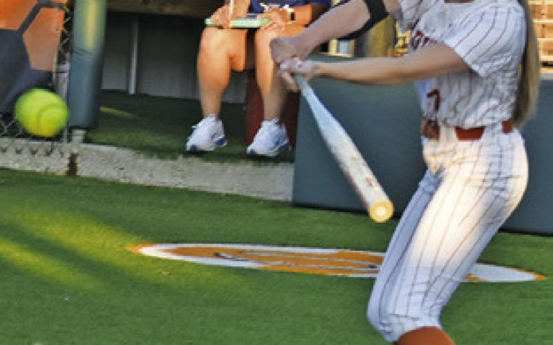 MAYZI WITHERWAX takes a swing at the ball during the Caldwell-Navasota game on Friday. Tribune photo by Roy Sanders