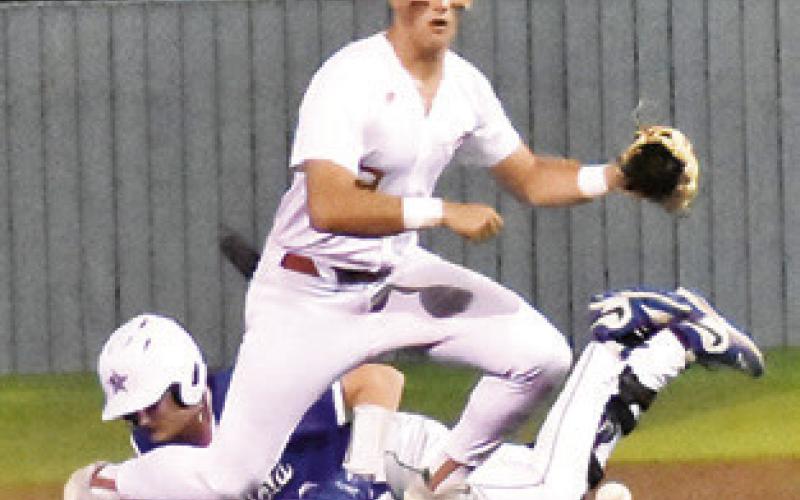 COY BECKA OF Caldwell reaches for the ball at second base against Navasota. Tribune photo by Roy Sanders