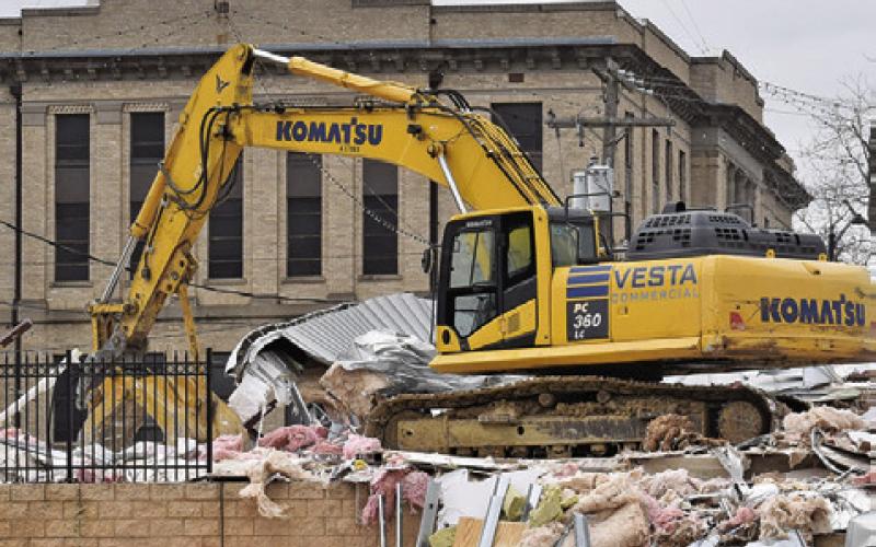 A DEMOLITION CREW continues its work last week at the city hall construction site in downtown Caldwell. Tribune photo by Roy Sanders